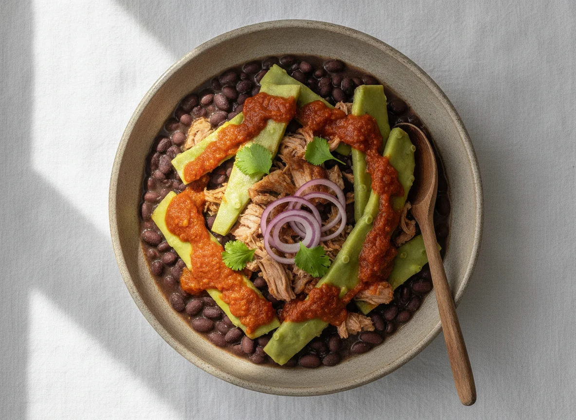 Frijoles negros con nopales y carne de cerdo photo