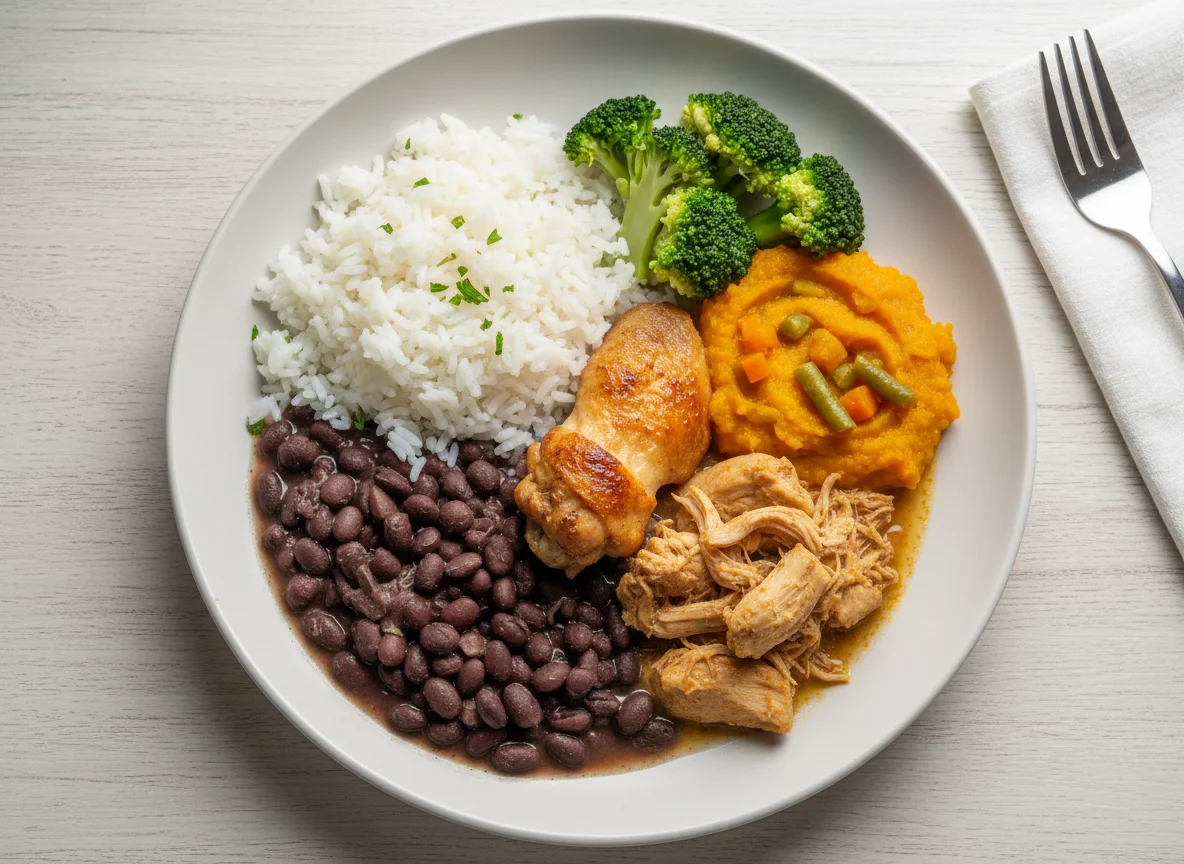 Prato completo com frango, feijão, arroz e legumes photo